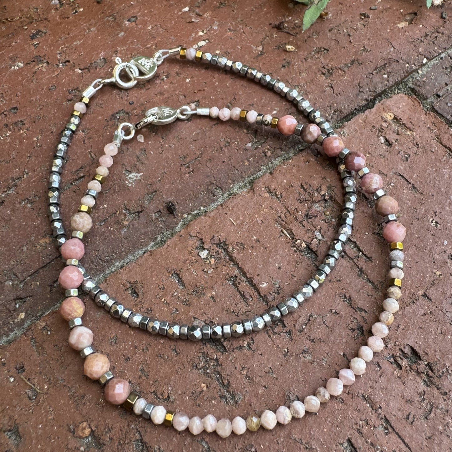 Handcrafted gemstone bracelet pair featuring Rodochrosite and Hematite beads. Inspired by Silverton, Colorado’s mining heritage.