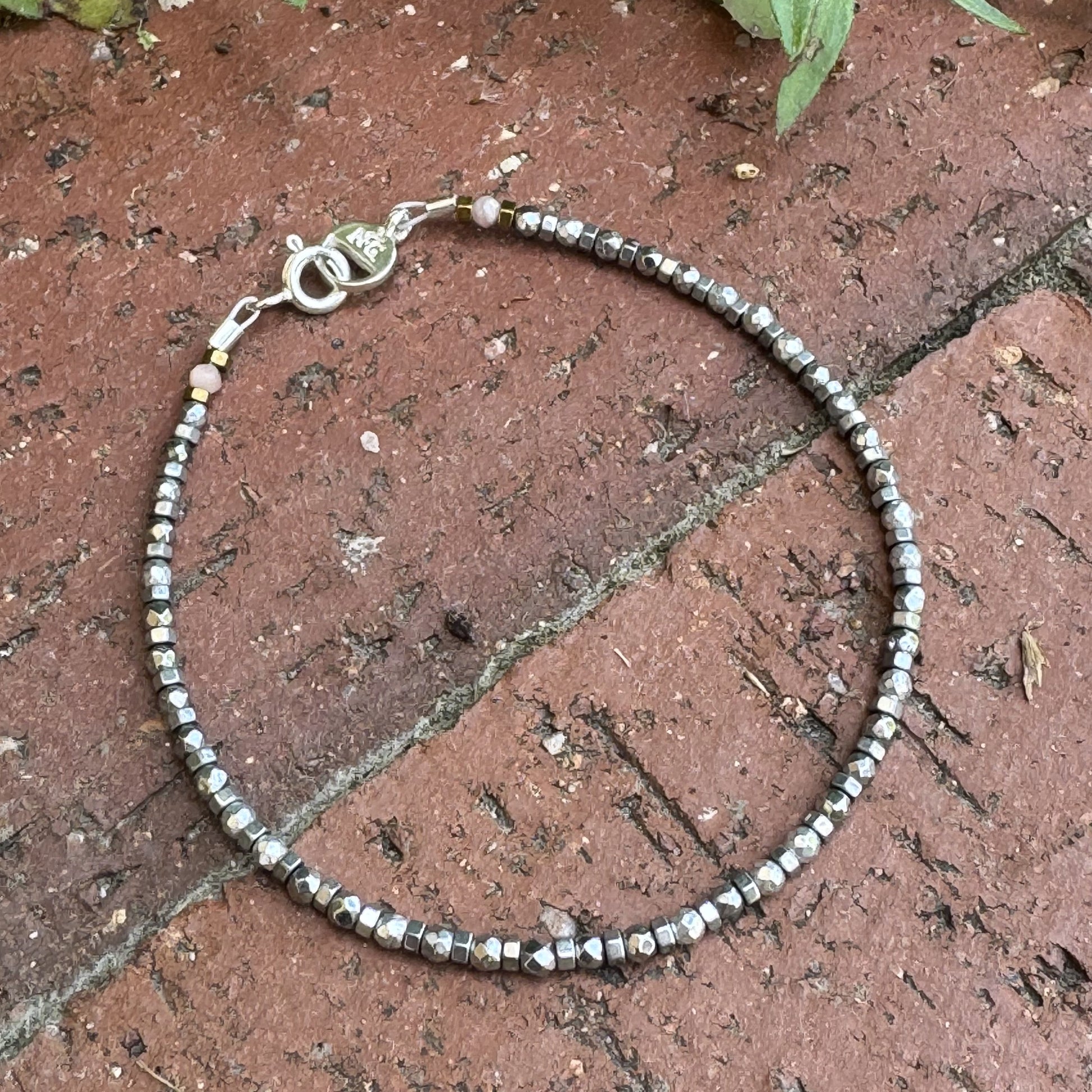 Handcrafted Hematite gemstone bracelet with subtle Rodochrosite accents, inspired by the mining town of Silverton, Colorado